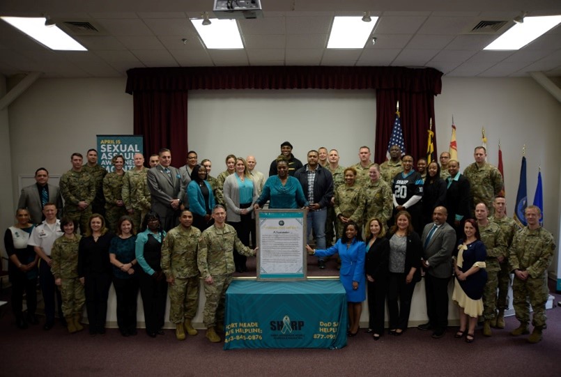 Director Kristina Rose and OVC staff gather with members of Fort George G. Meade Army installation