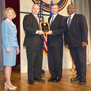 Sergeant Gregory Scott Waldron with Deborah Daniels, John Ashcroft, and John Gillis