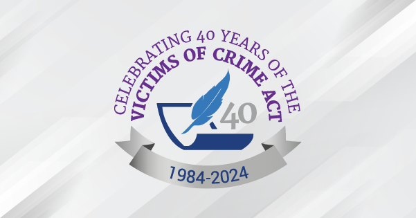 VOCA 40th Anniversary Logo featuring a quill next to the number 40, both above a piece of paper.