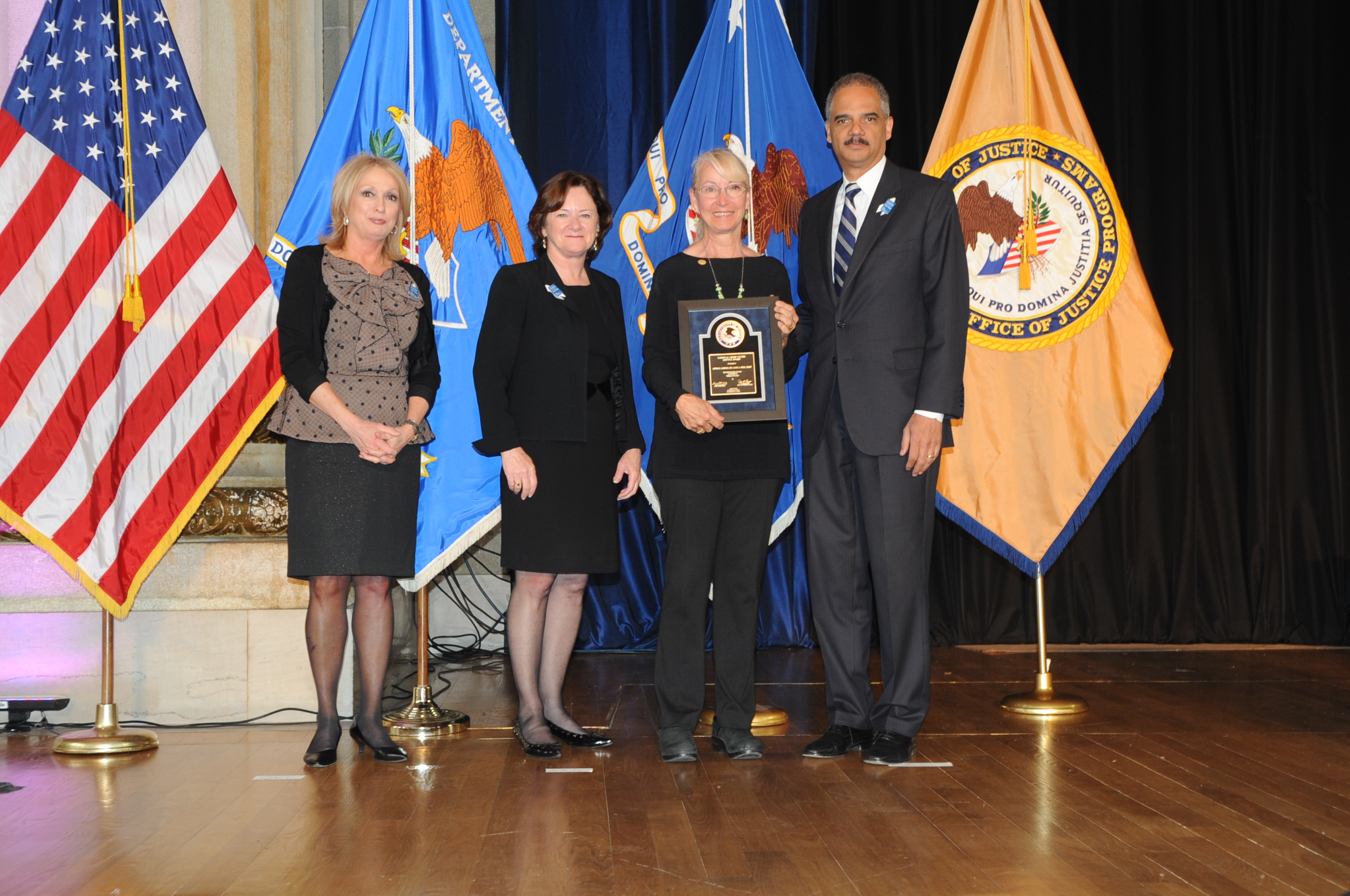 2012 National Crime Victim Service Award recipient Dr. Linda Ledray with (from left) Joye E. Frost, Acting Director, Office for Victims of Crime; Acting Assistant Attorney General Mary Lou Leary, Office of Justice Programs; and U.S. Attorney General Eric H. Holder, Jr.