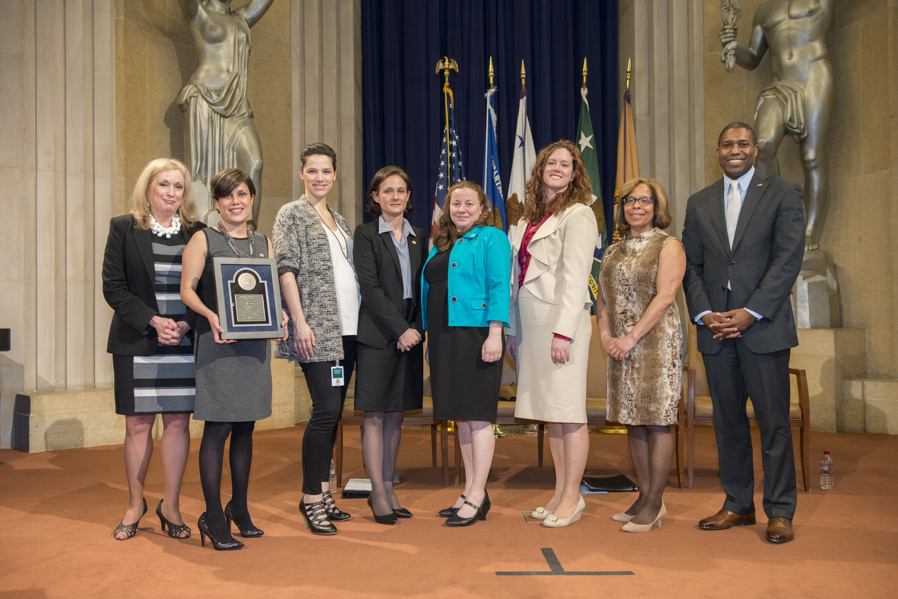 Natalia Marlow Otero, Andrea Sledd, Elisabeth Olds, Jennifer Wesberry, and Baylis Beard accept the 2014 National Crime Victim Service Award for DC SAFE, with Joye E. Frost, Director, Office for Victims of Crime; Karol V. Mason, Assistant Attorney General, Office of Justice Programs; and Associate Attorney General Tony West.