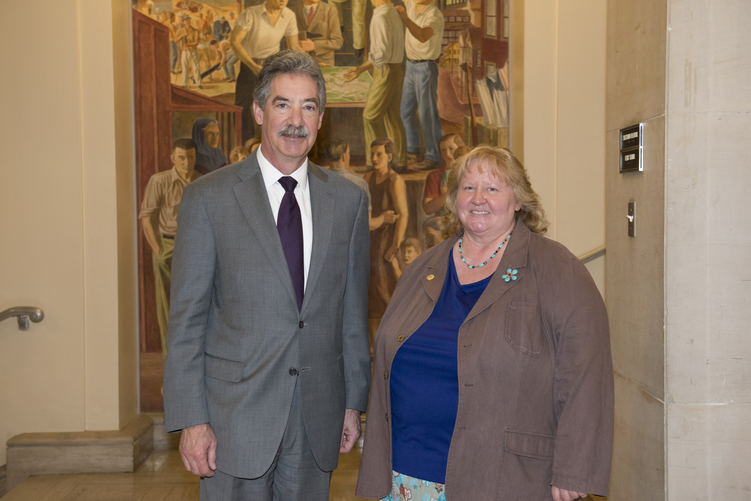 Hazel Heckers, a 2014 National Crime Victim Service Award recipient, appears with Deputy Attorney General James M. Cole.