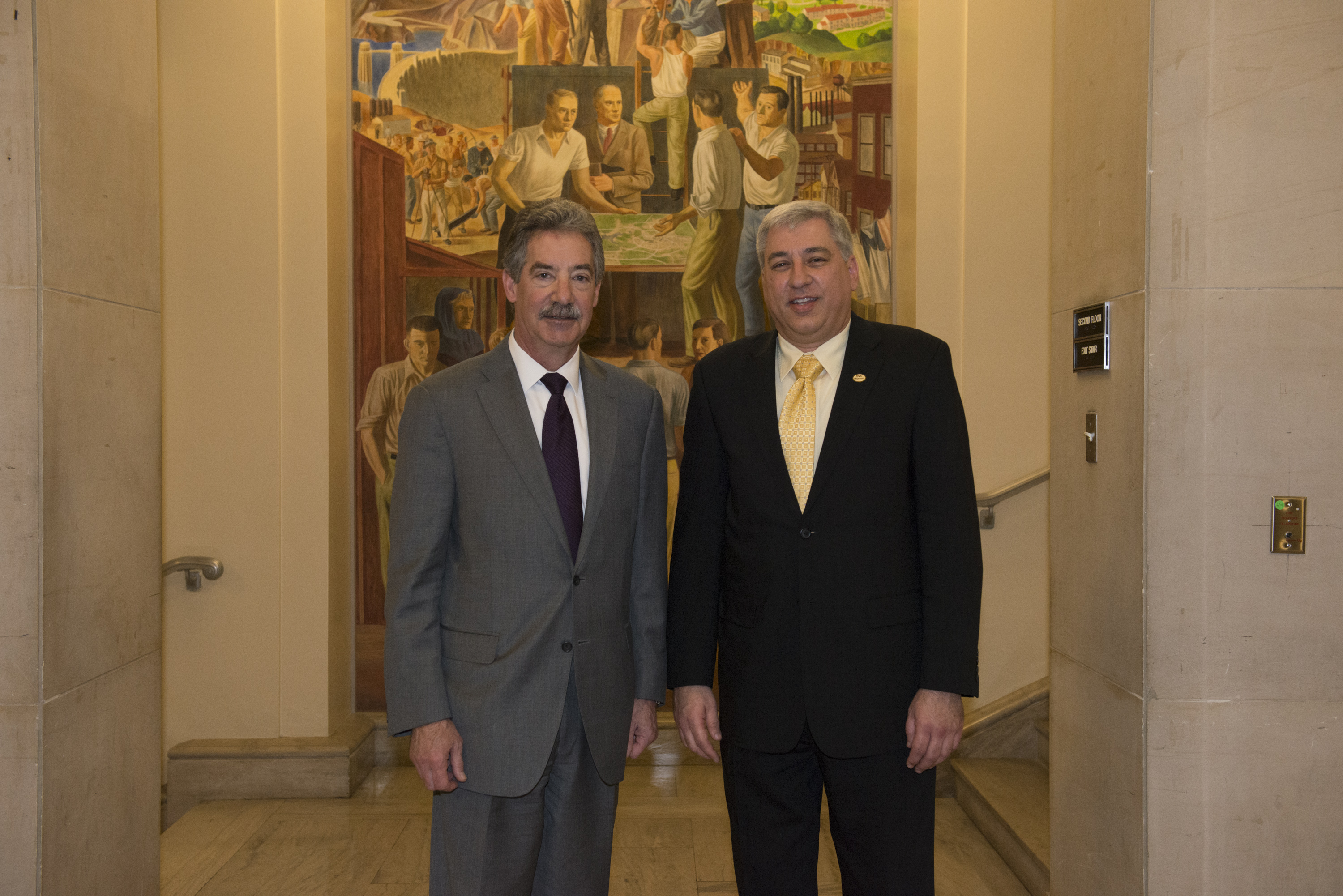 Paul Traub, a 2014 Special Courage Award recipient, appears with Deputy Attorney General James M. Cole.