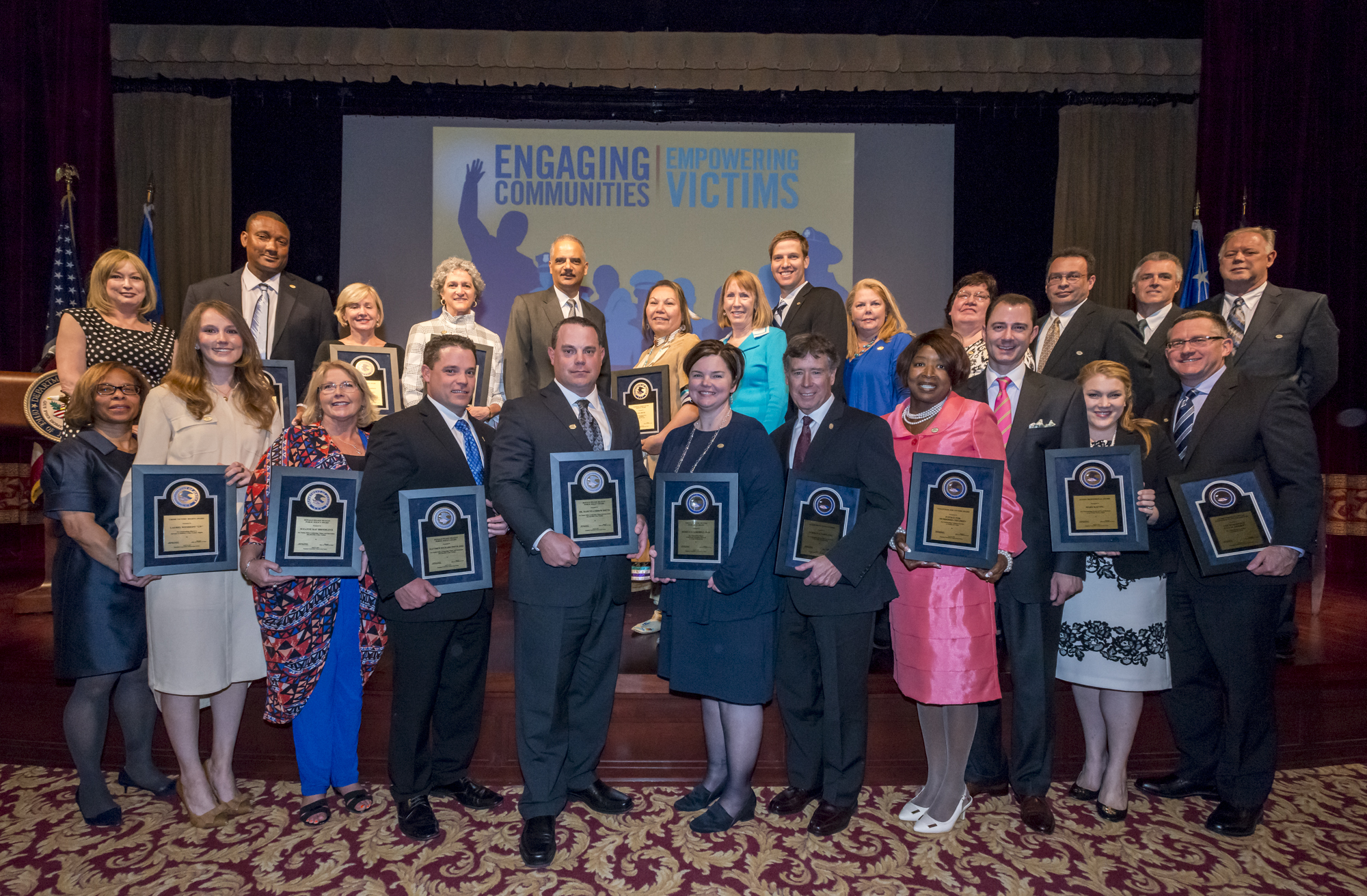 The 2015 National Crime Victims' Service Awards recipients with Attorney General Eric H. Holder, Jr., Assistant Attorney General Karol V. Mason, and OVC Director Joye E. Frost.