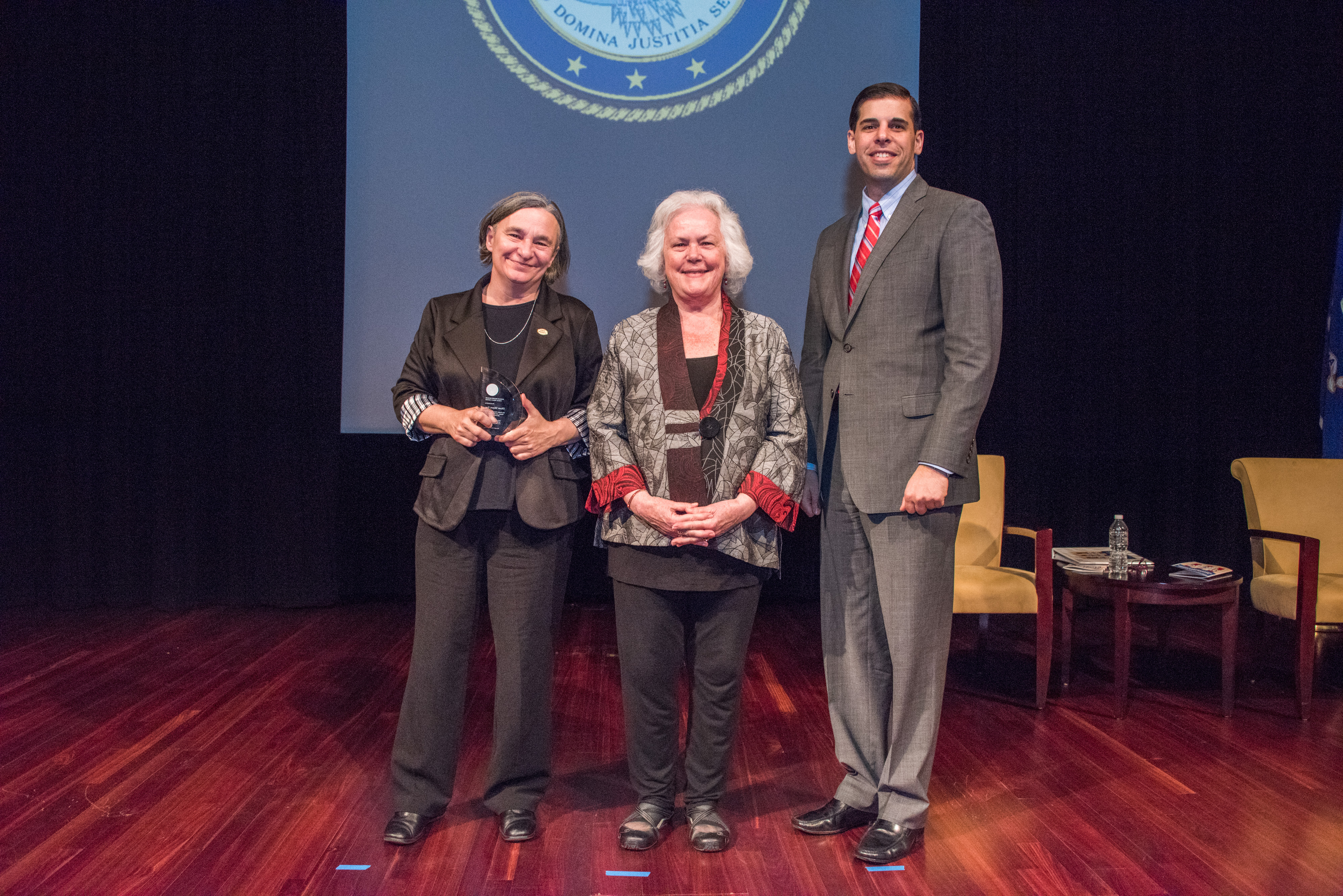 2017 Ronald Wilson Reagan Public Policy Award recipient Diane Moyer, Esq. with (from left) Acting OVC Director Marilyn McCoy Roberts and Acting Associate Attorney General Jesse Panuccio.