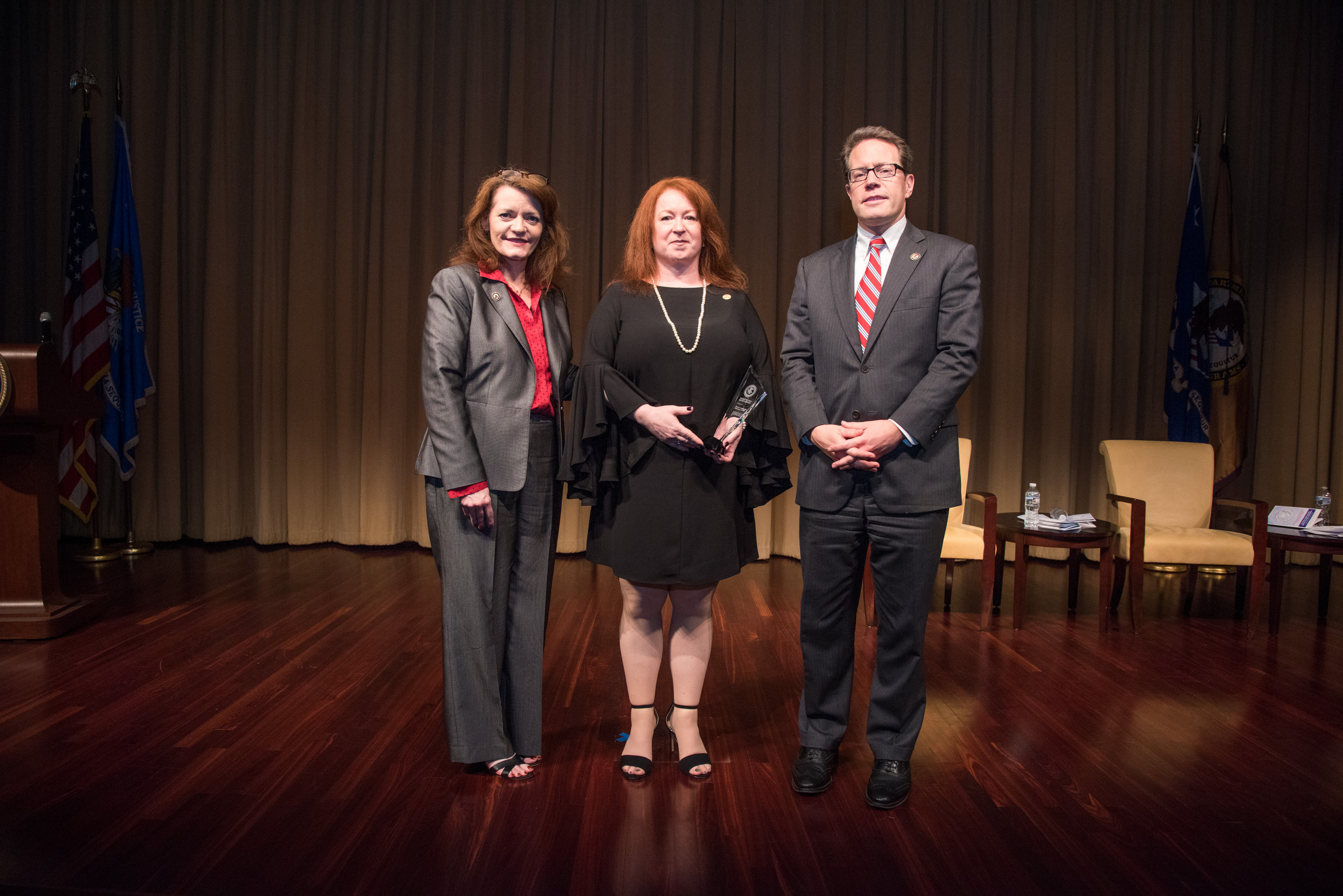 2018 Crime Victims' Rights Award recipient Dawne Lomangino-DiMauro, LCSW, with (from left) OVC Director Darlene Hutchinson and Principal Deputy Assistant Attorney General for the Office of Justice Programs Alan Hanson.