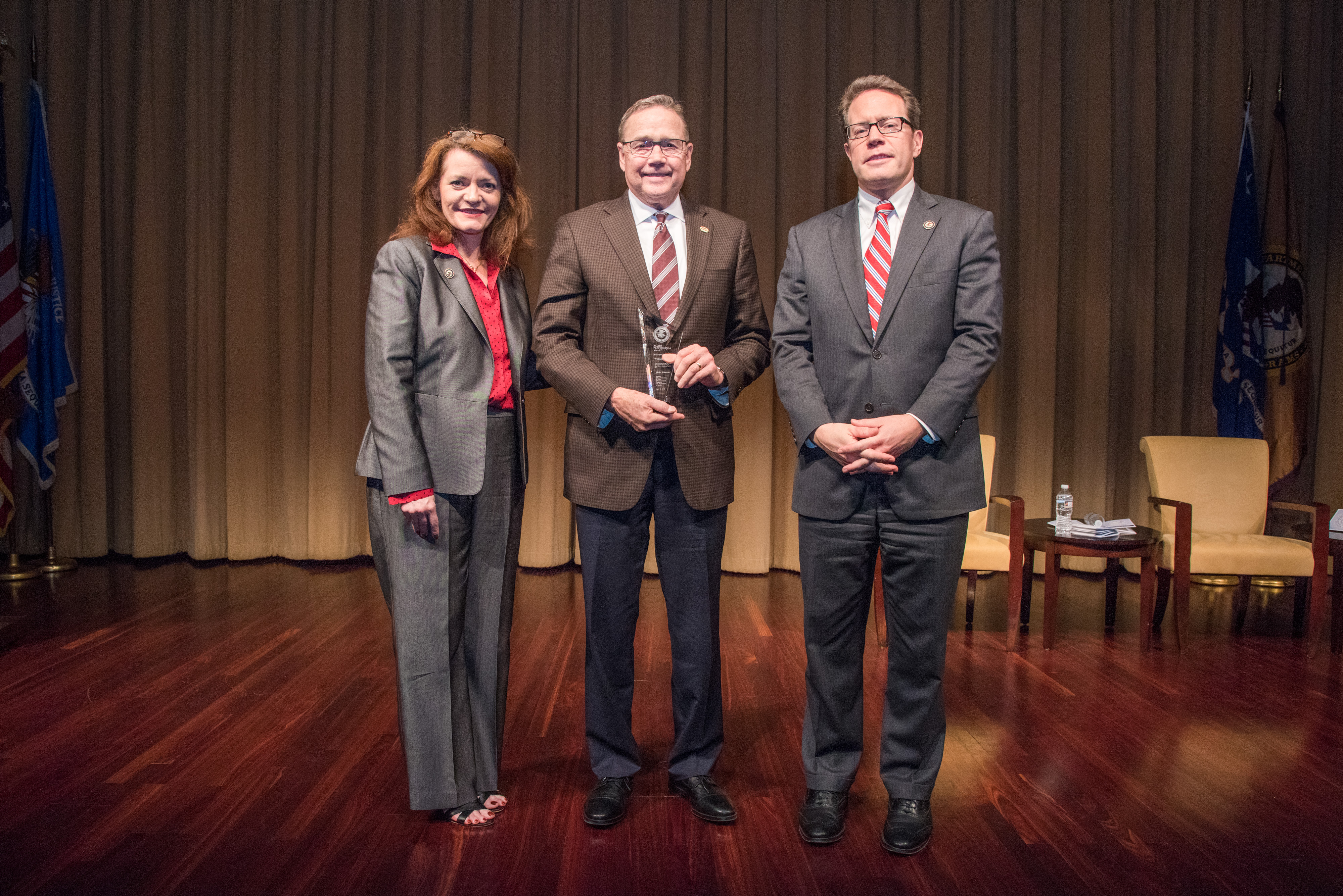 2018 Allied Professional Award recipient William Citty with (from left) OVC Director Darlene Hutchinson and Principal Deputy Assistant Attorney General for the Office of Justice Programs Alan Hanson.