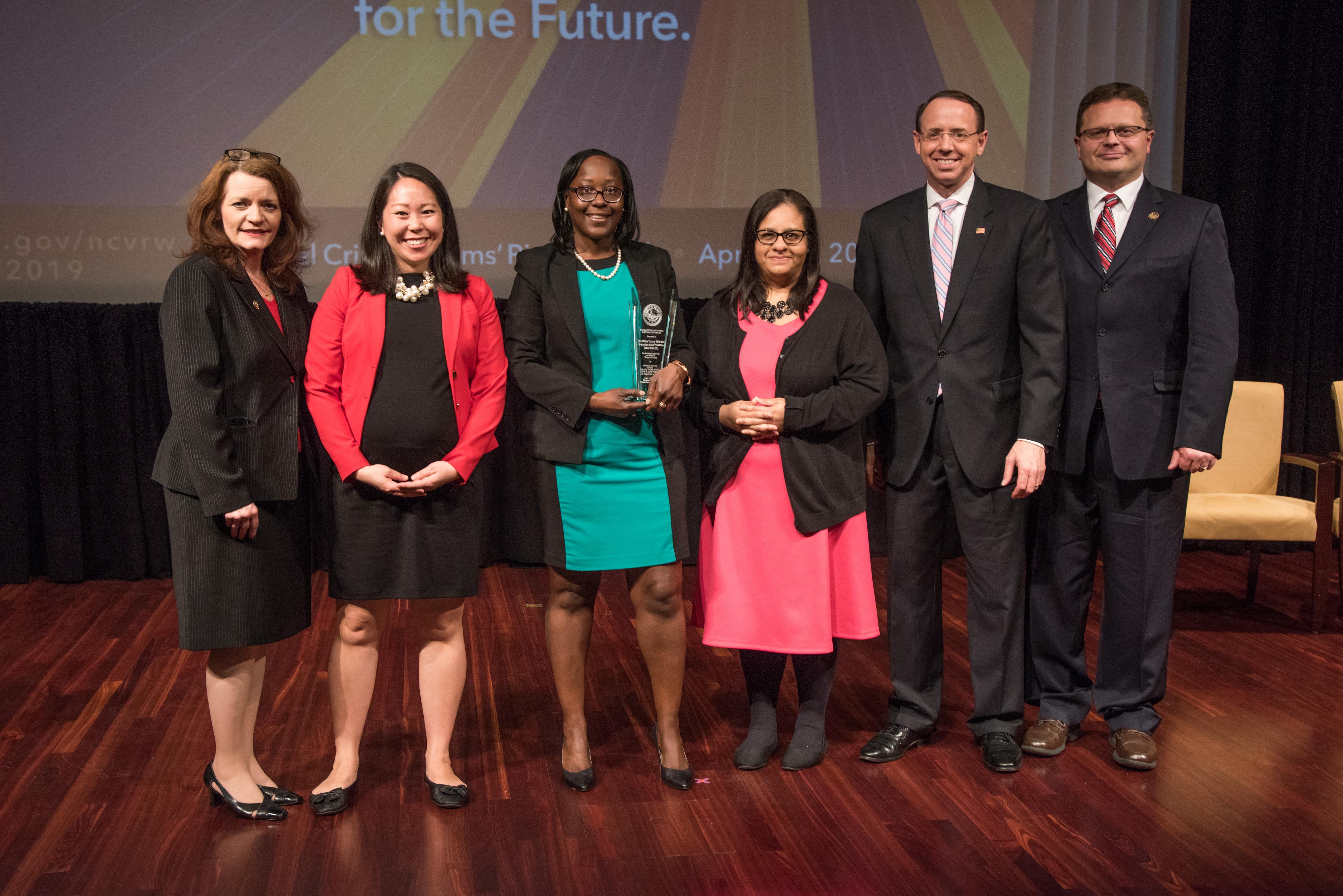 The San Mateo County Elder and Dependent Adult Protection Team receives the 2019 Crime Victims Financial Restoration Award. Pictured from left: OVC Director Darlene Hutchinson, Nicole Sato, Shannon Morgan, Nicole Fernandez, Deputy Attorney General Rod J. Rosenstein, and Principal Deputy Assistant Attorney General for the Office of Justice Programs Matt M. Dummermuth.