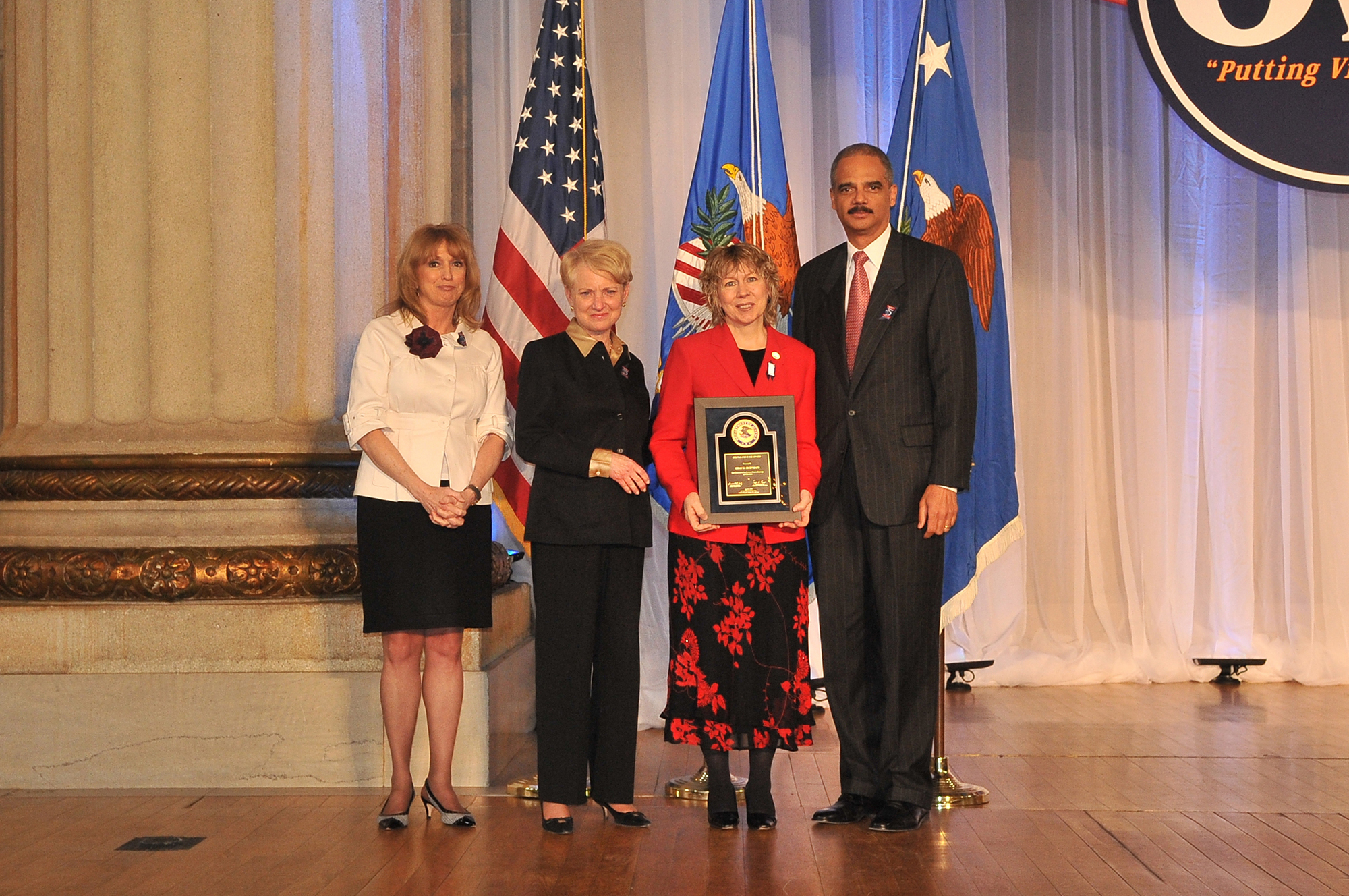 Award recipient Gracia Burnham, with (from left) Joye E. Frost, Acting Director, Office for Victims of Crime; Laurie O. Robinson, Acting Assistant Attorney General, Office of Justice Programs; and U.S. Attorney General Eric H. Holder, Jr.