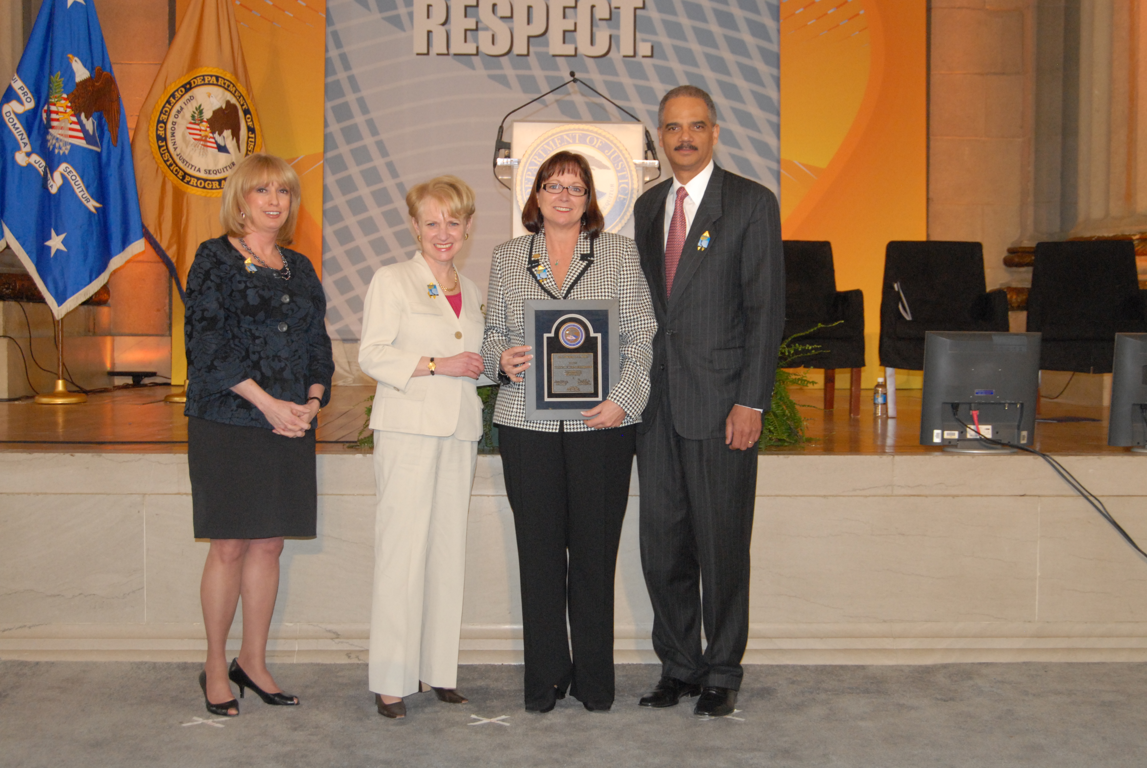 2010 Allied Professional Award recipient Joanne Archambault with (from left) Joye E. Frost, Acting Director, Office for Victims of Crime; Assistant Attorney General Laurie O. Robinson, Office of Justice Programs; and U.S. Attorney General Eric H. Holder, Jr.