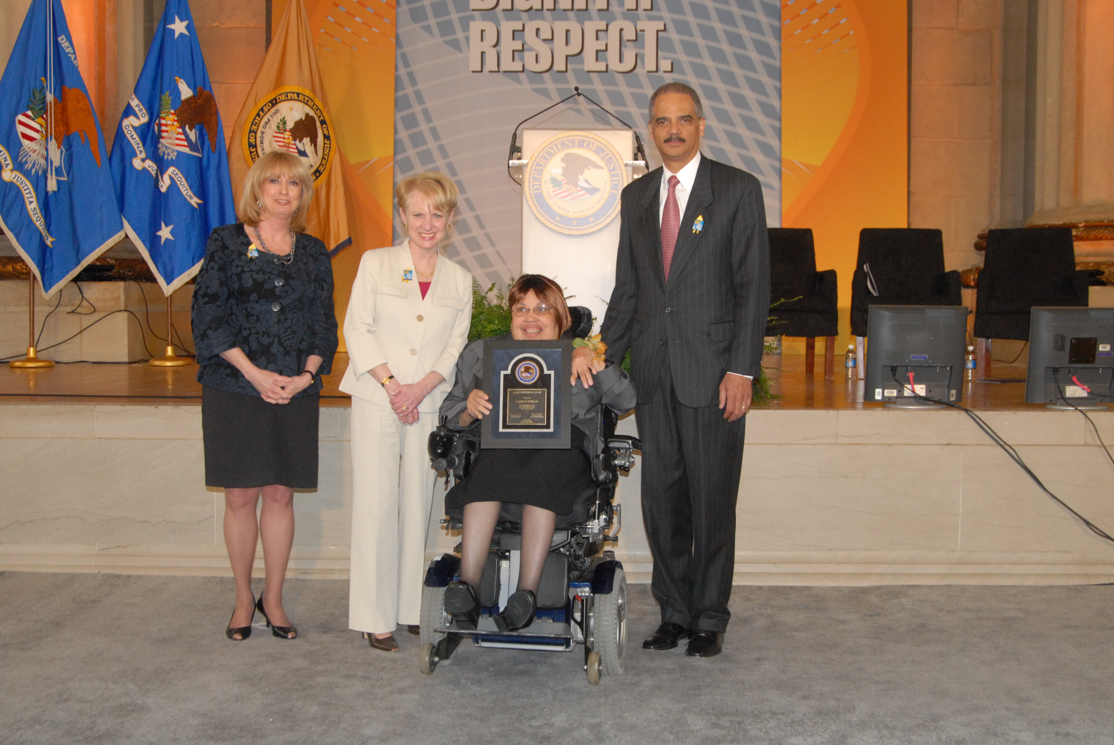 2010 Allied Professional Award recipient Carolyn Morgan with (from left) Joye E. Frost, Acting Director, Office for Victims of Crime; Assistant Attorney General Laurie O. Robinson, Office of Justice Programs; and U.S. Attorney General Eric H. Holder, Jr.