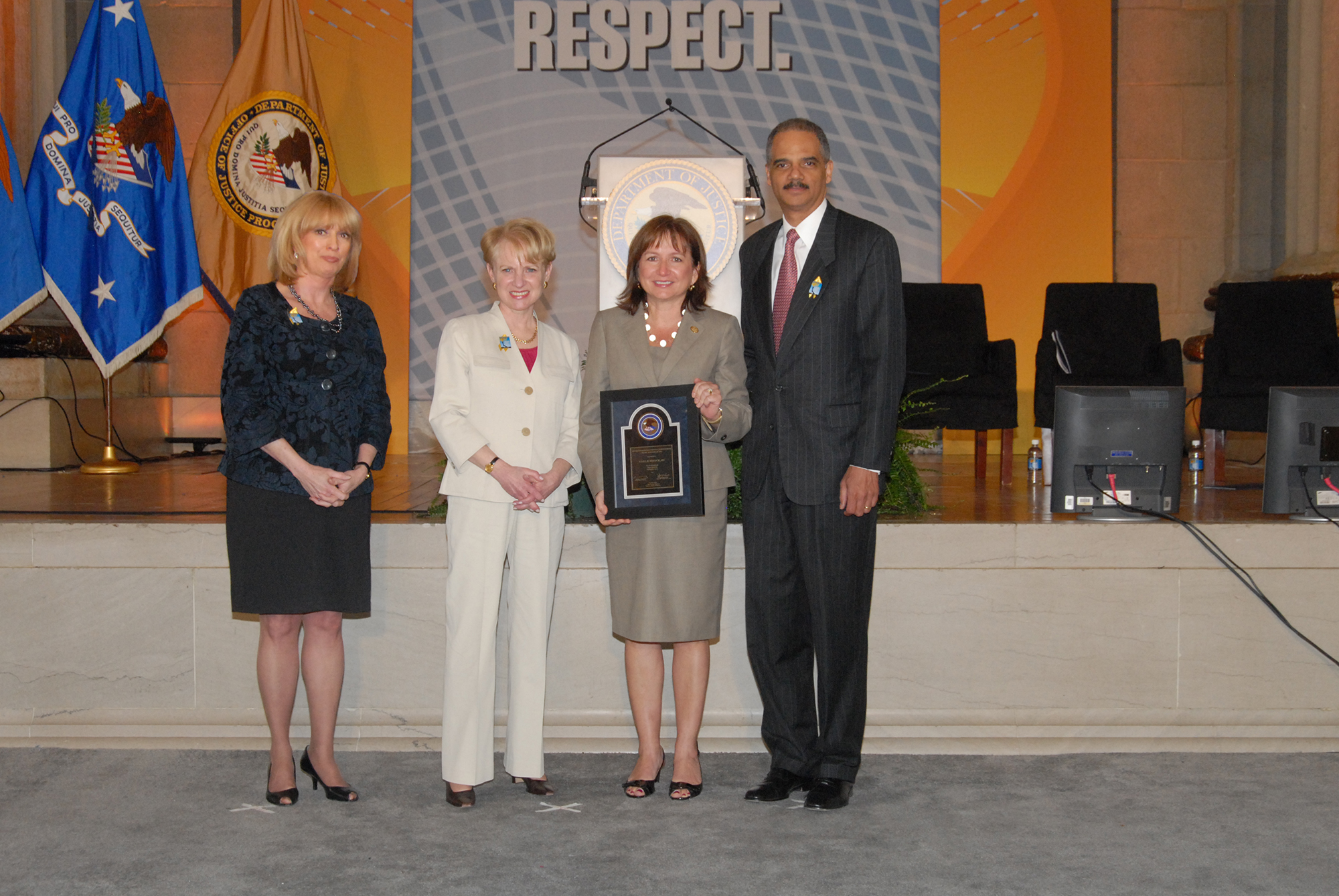 2010 Allied Professional Award recipient Gael B. Strack with (from left) Joye E. Frost, Acting Director, Office for Victims of Crime; Assistant Attorney General Laurie O. Robinson, Office of Justice Programs; and U.S. Attorney General Eric H. Holder, Jr.