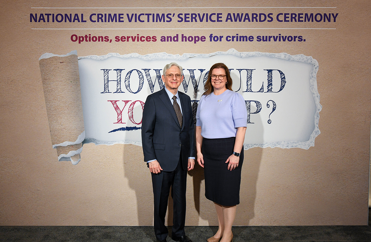 Dr. Angela Pharris with Attorney General Merrick B. Garland at the 2024 National Crime Victims' Rights Week Candlelight Vigil.