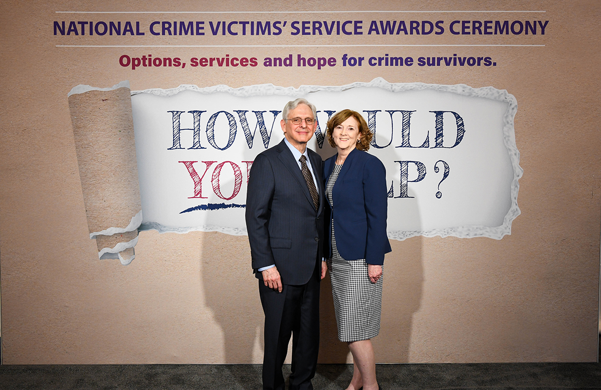 Joan Meunier-Sham, MS, RN with Attorney General Merrick B. Garland at the 2024 National Crime Victims' Rights Week Candlelight Vigil.
