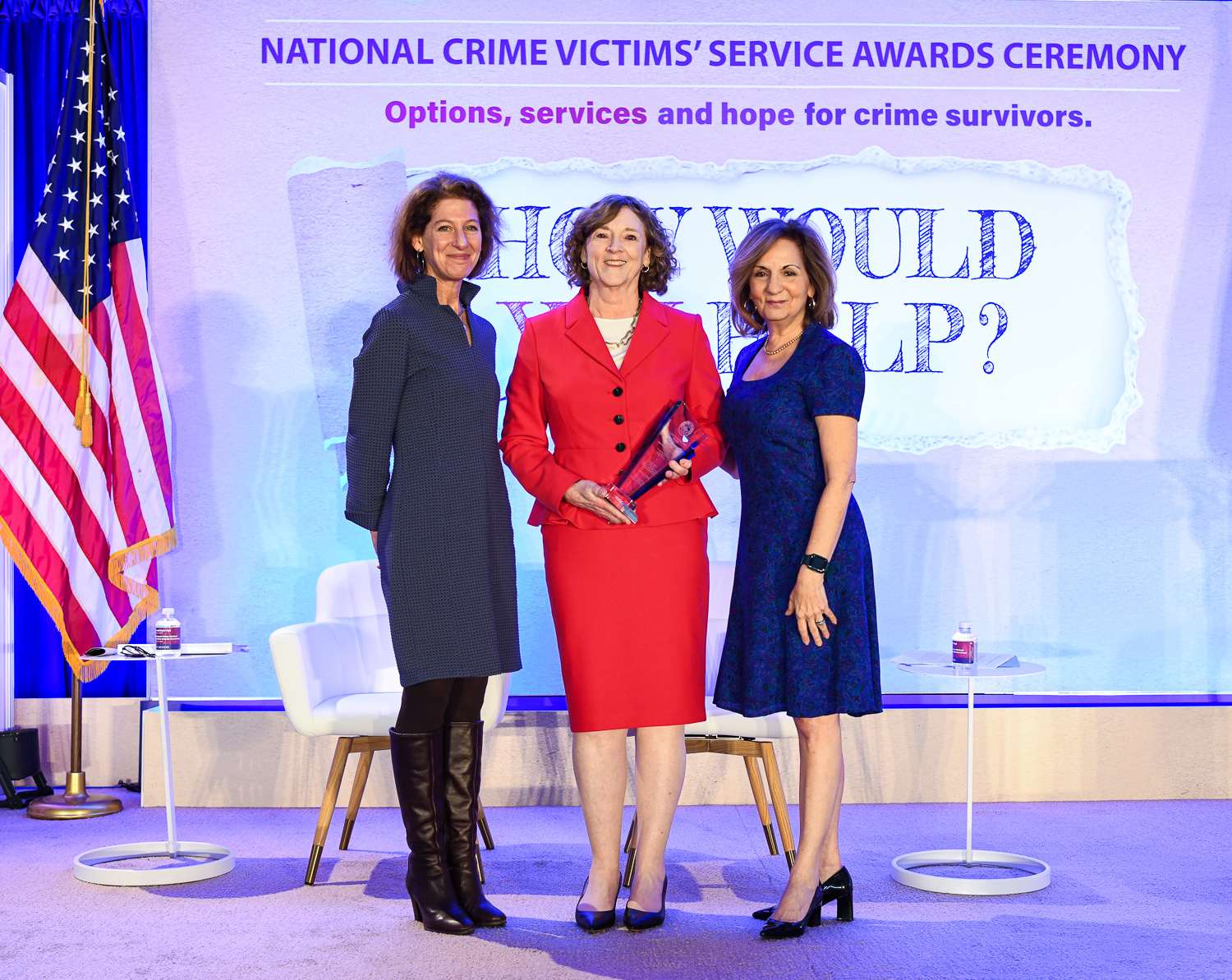 Joan Meunier-Sham, MS, RN receives the 2024 Allied Professional Award with (from left) OVC Director Kristina Rose and Assistant Attorney General Amy L. Solomon.