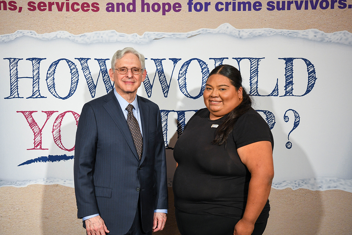 Jocelyn Mejia with Attorney General Merrick B. Garland at the 2024 National Crime Victims' Rights Week Candlelight Vigil.