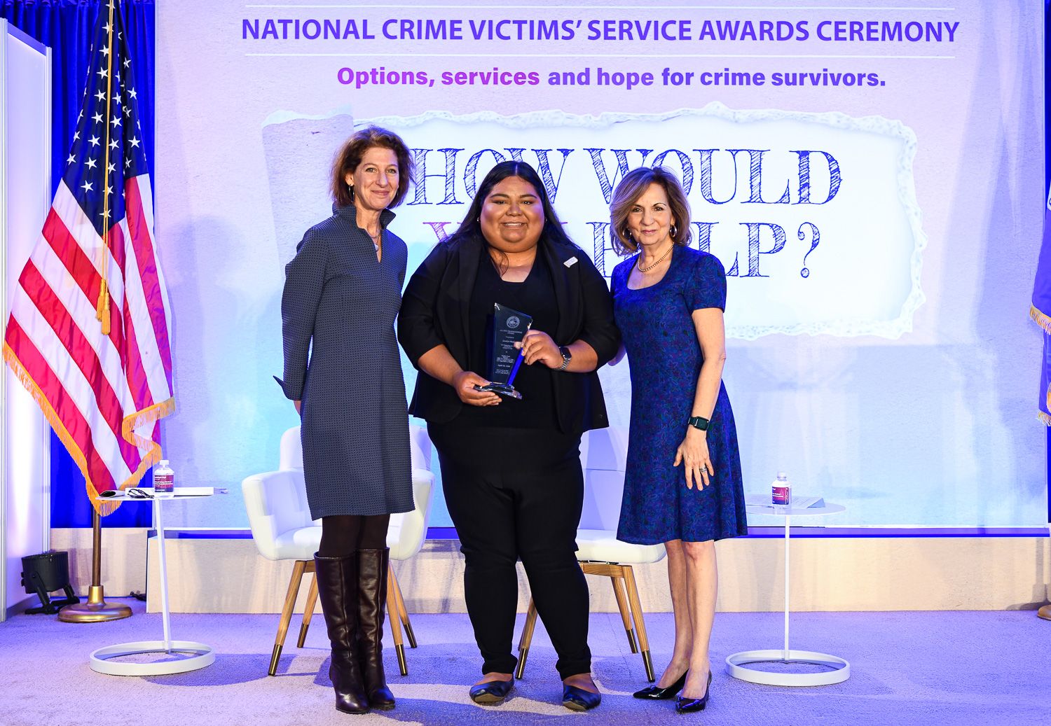 Jocelyn Mejia receives the 2024 Allied Professional Award with (from left) OVC Director Kristina Rose and Assistant Attorney General Amy L. Solomon.
