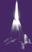 Photo of hands holding candles aloft in commemoration of National Crime Victims' Rights Week events.