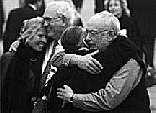 Photograph of Suse Lowenstein and Peter Tsairis, and his wife Aphrodite Tsairis, being hugged by Peter Lowenstein, after announcement of the verdict of the Pan Am 103 trial. The Lowensteins son Alexander (21) and the Tsairis daughter Alexia (20) were both victims.