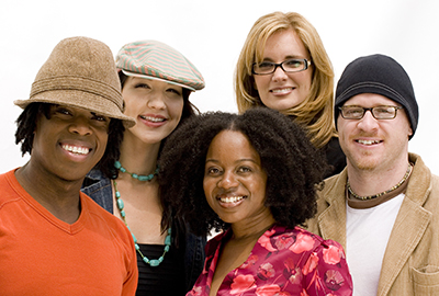 group of five young women and men, smiling