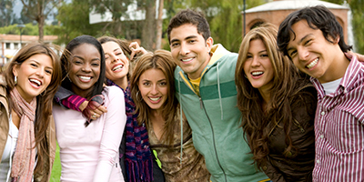 Group of young men and women smiling and laughing