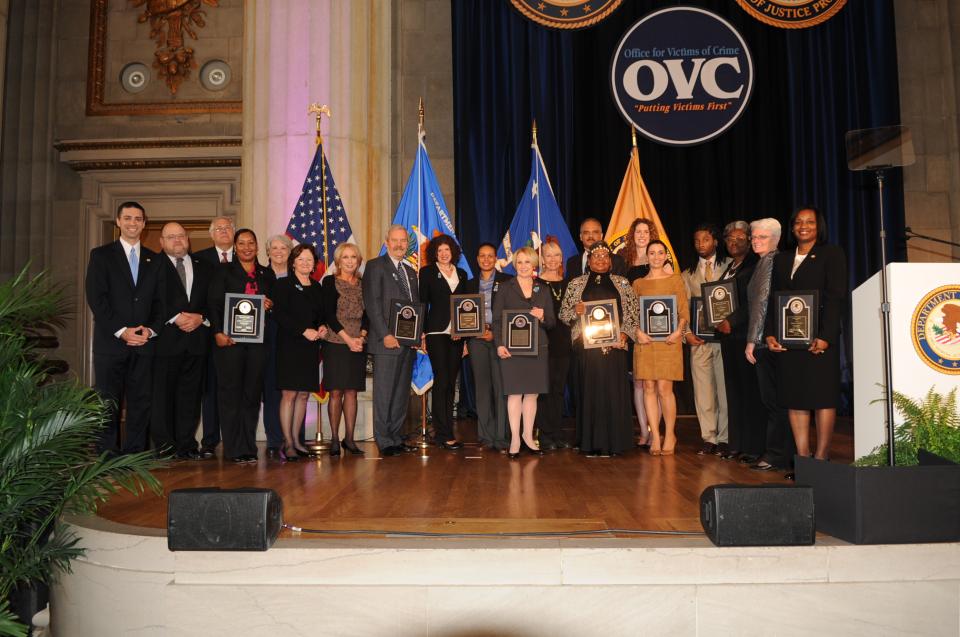 The 2012 National Crime Victims’ Service Awards recipients with Joye E. Frost, Acting Director, Office for Victims of Crime; Acting Assistant Attorney General Mary Lou Leary, Office of Justice Programs; and U.S. Attorney General Eric H. Holder, Jr.