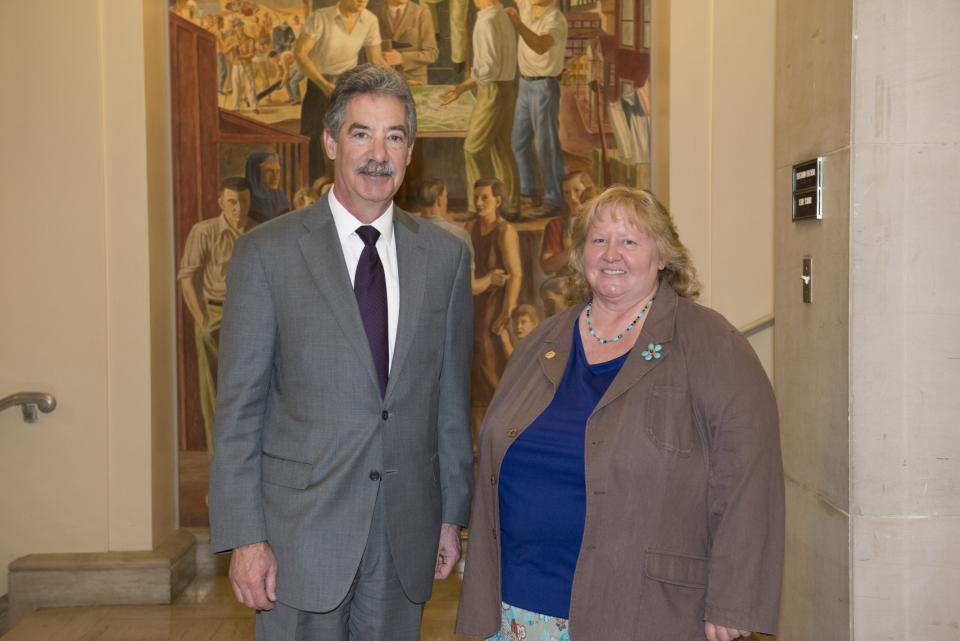 Hazel Heckers, a 2014 National Crime Victim Service Award recipient, appears with Deputy Attorney General James M. Cole.