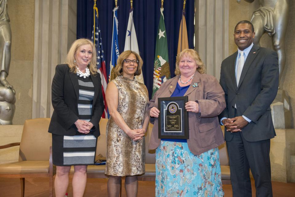 2014 National Crime Victim Service Award recipient Hazel Heckers with (from left) Joye E. Frost, Director, Office for Victims of Crime; Karol V. Mason, Assistant Attorney General, Office of Justice Programs; and Associate Attorney General Tony West.
