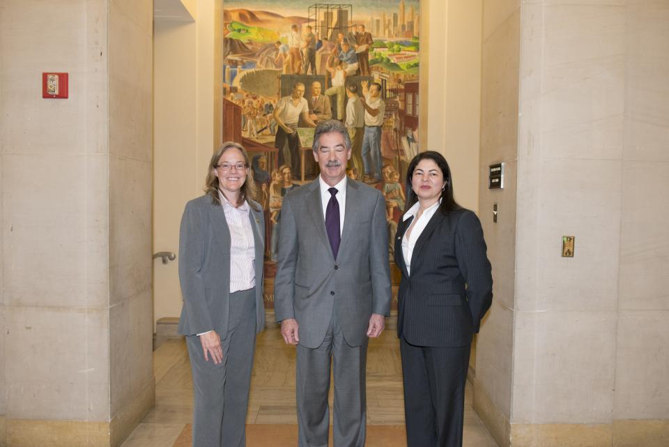 Members of the Rapid DNA Service Team, a 2014 Award for Professional Innovation in Victim Services recipient, appear with Deputy Attorney General James M. Cole