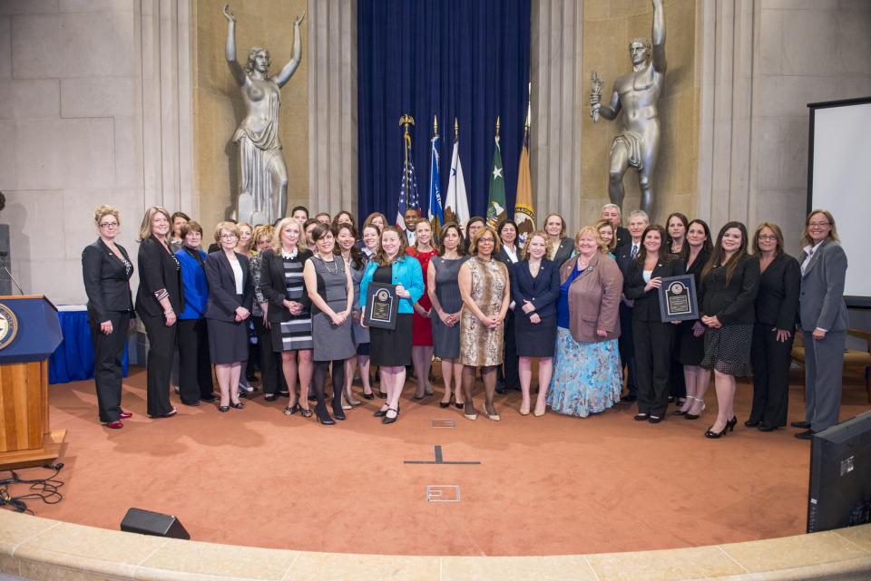 The 2014 National Crime Victims' Service Awards recipients on stage at the awards ceremony.