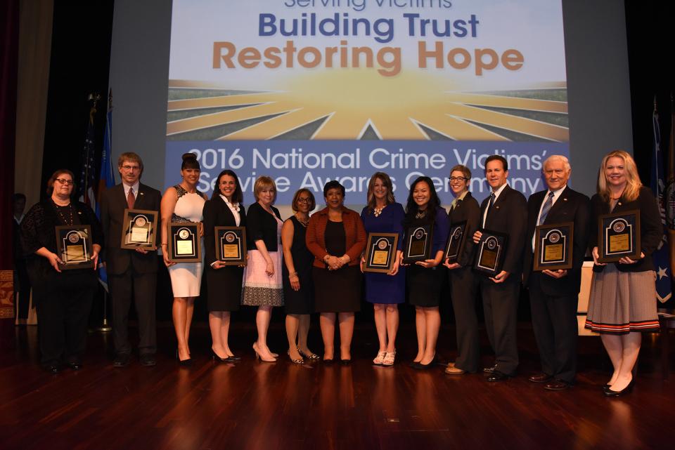 The 2016 National Crime Victims' Service Awards recipients with Joye E. Frost, Director, Office for Victims of Crime; Karol V. Mason, Assistant Attorney General; and Attorney General Loretta E. Lynch.