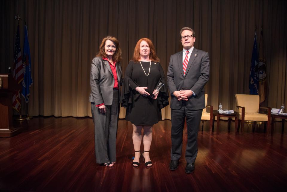 2018 Crime Victims' Rights Award recipient Dawne Lomangino-DiMauro, LCSW, with (from left) OVC Director Darlene Hutchinson and Principal Deputy Assistant Attorney General for the Office of Justice Programs Alan Hanson.