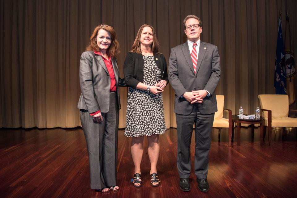 National Crime Victim Service Award recipient Debra McCall Reed with (from left) OVC Director Darlene Hutchinson and Principal Deputy Assistant Attorney General for the Office of Justice Programs Alan Hanson.