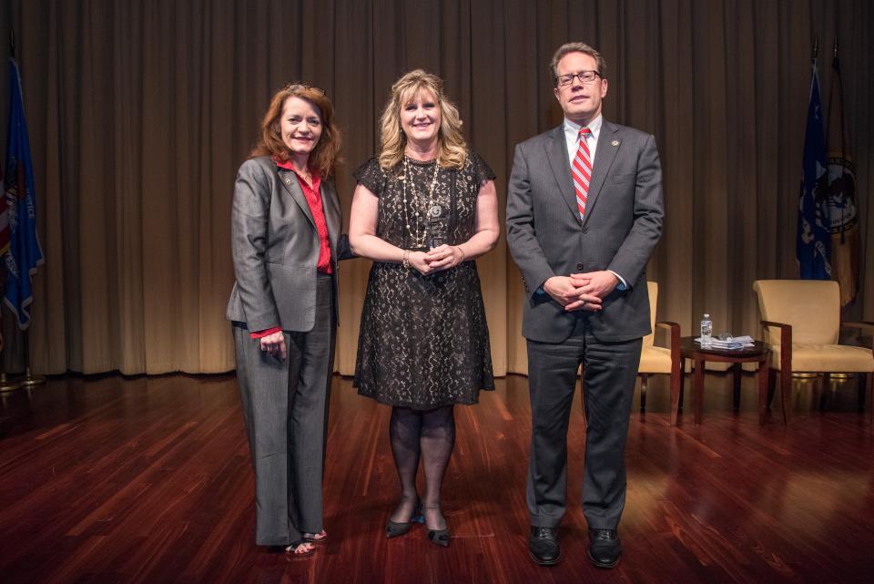 Special Courage Award recipient Michelle L. Kuiper with (from left) OVC Director Darlene Hutchinson and Principal Deputy Assistant Attorney General for the Office of Justice Programs Alan Hanson.