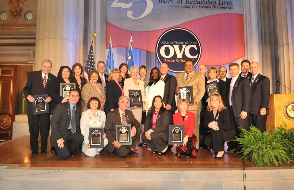 The 2009 National Crime Victims' Rights Week Award recipients on stage.