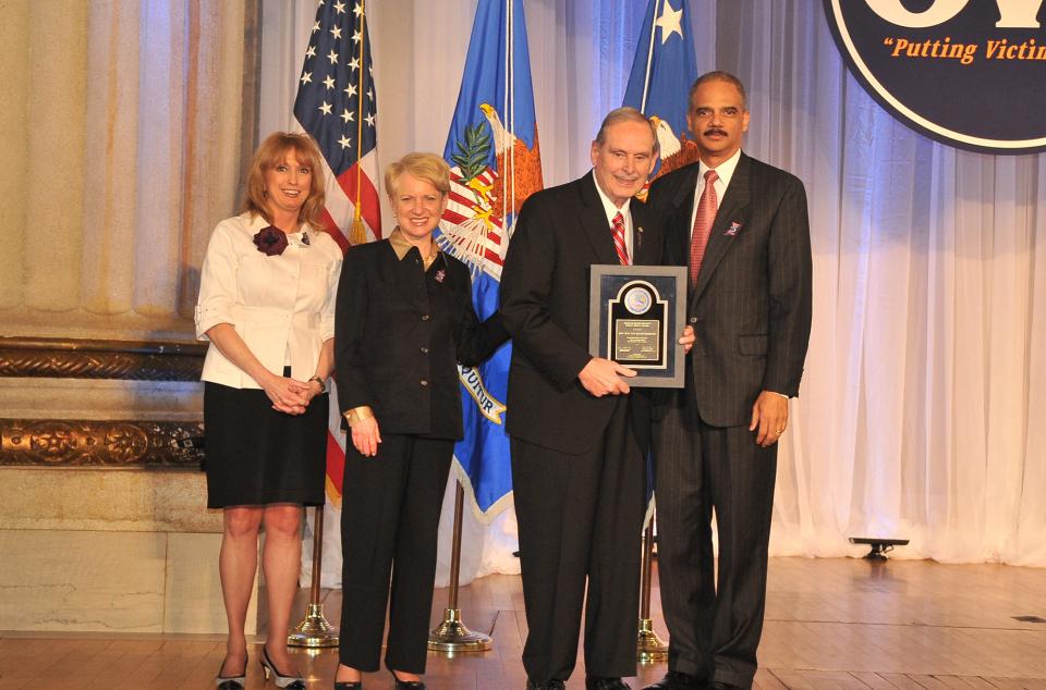 Award recipient William Van Regenmorter, with (from left) Joye E. Frost, Acting Director, Office for Victims of Crime; Laurie O. Robinson, Acting Assistant Attorney General, Office of Justice Programs; and U.S. Attorney General Eric H. Holder, Jr.
