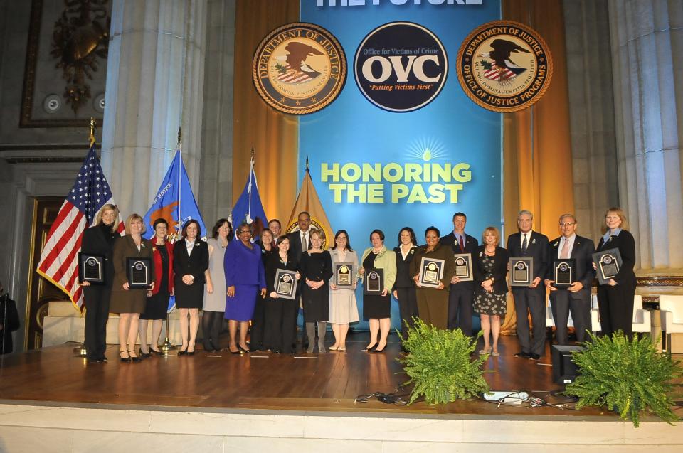 The 2011 National Crime Victims’ Service Awards recipients on stage.
