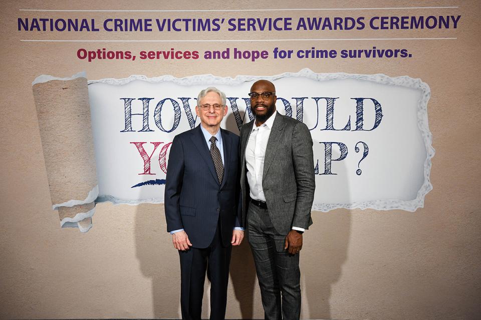 Aswad Thomas, MSW with Attorney General Merrick B. Garland at the 2024 National Crime Victims' Rights Week Candlelight Vigil.