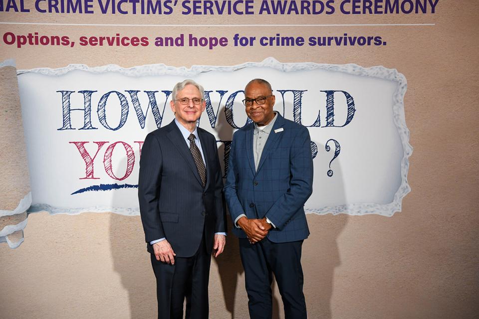 Herman Millholland with Attorney General Merrick B. Garland at the 2024 National Crime Victims' Rights Week Candlelight Vigil.