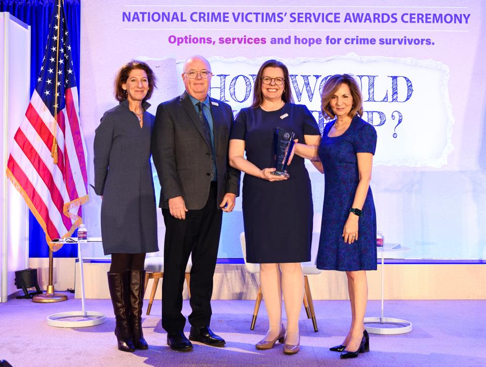 The Hope Research Center receives the 2024 Building Knowledge Through Research Award with (from left) OVC Director Kristina Rose and Assistant Attorney General Amy L. Solomon.