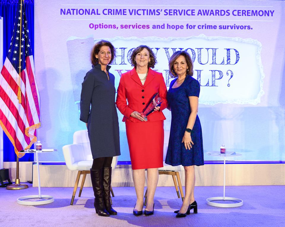 Joan Meunier-Sham, MS, RN receives the 2024 Allied Professional Award with (from left) OVC Director Kristina Rose and Assistant Attorney General Amy L. Solomon.