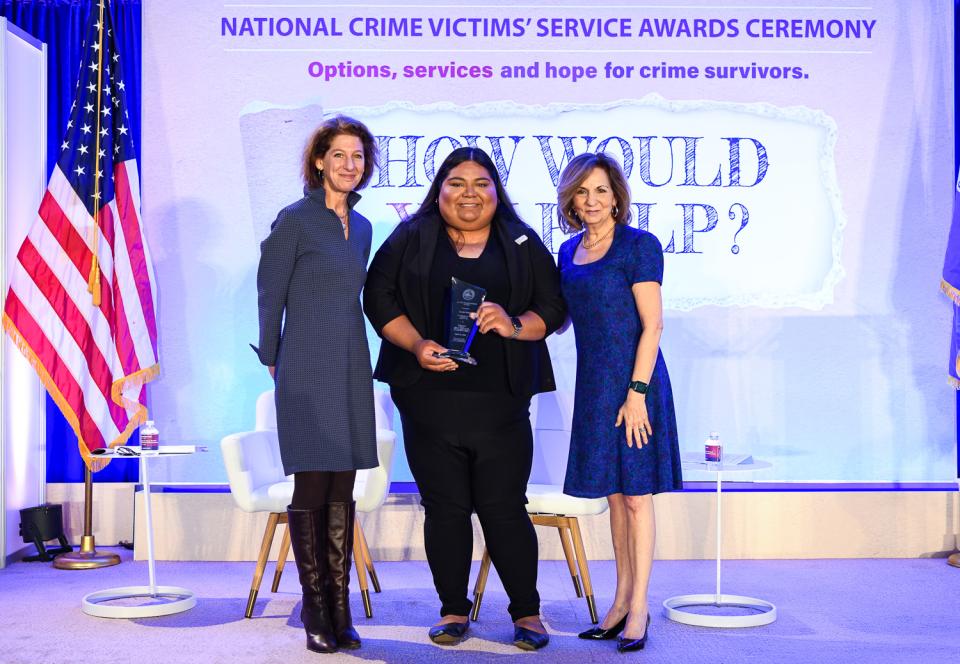 Jocelyn Mejia receives the 2024 Allied Professional Award with (from left) OVC Director Kristina Rose and Assistant Attorney General Amy L. Solomon.