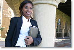 Photo of a woman holding a notebook and smiling