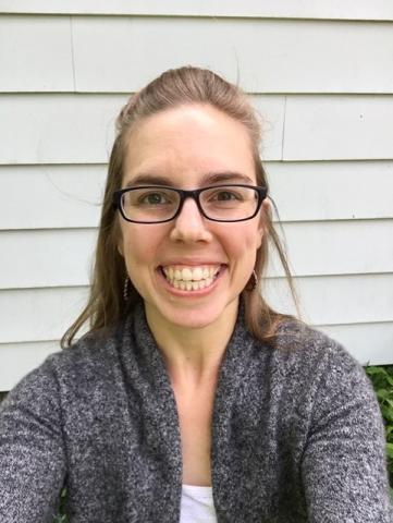 Headshot of Amanda Powers in a grey sweater